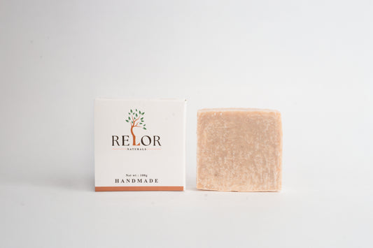 Handmade natural soap bar with RELOR NATURALS packaging for soft and healthy skin