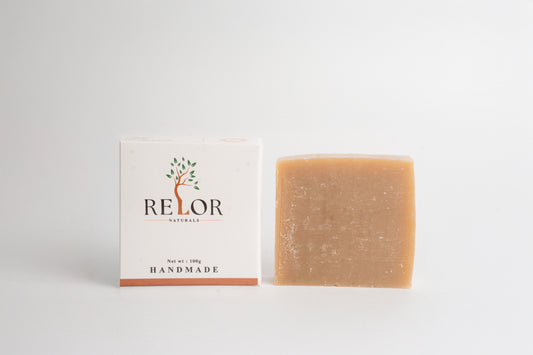 Handmade natural soap bar with RELOR NATURALS packaging for soft and healthy skin