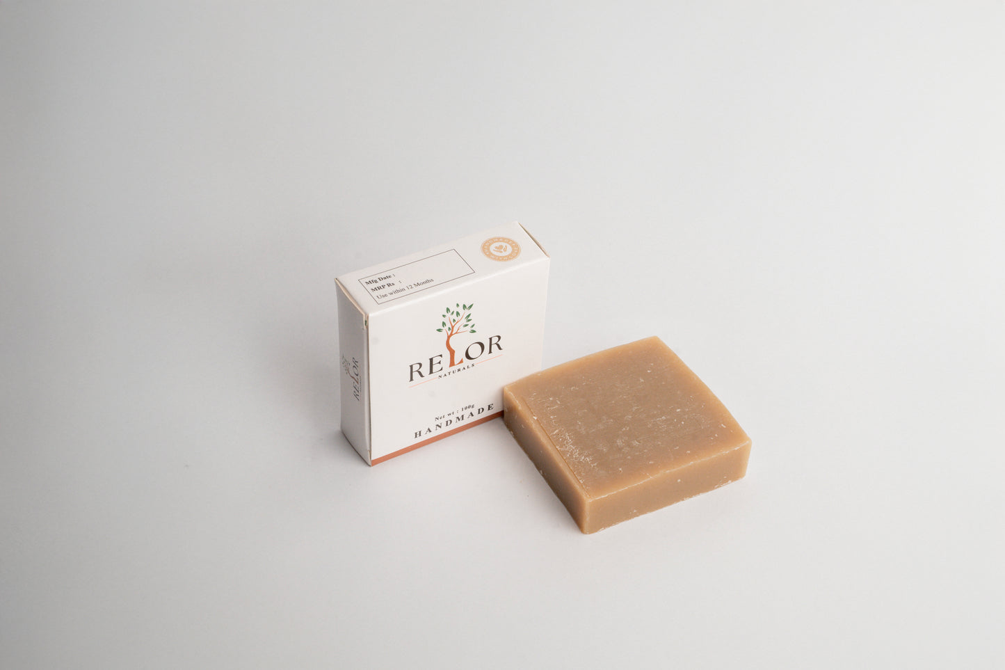 Handmade natural soap bar with RELOR NATURALS packaging for soft and healthy skin