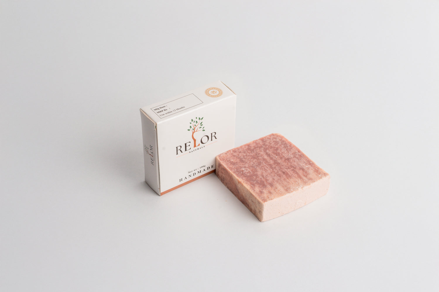 Handmade natural soap bar with RELOR NATURALS packaging for soft and healthy skin