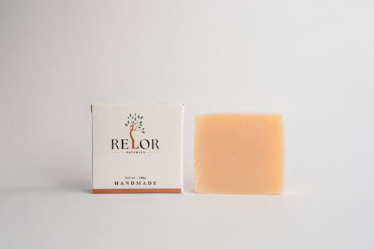 Handmade natural soap bar with RELOR NATURALS packaging for soft and healthy skin