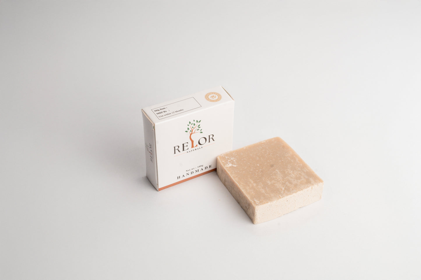 Handmade natural soap bar with RELOR NATURALS packaging for soft and healthy skin