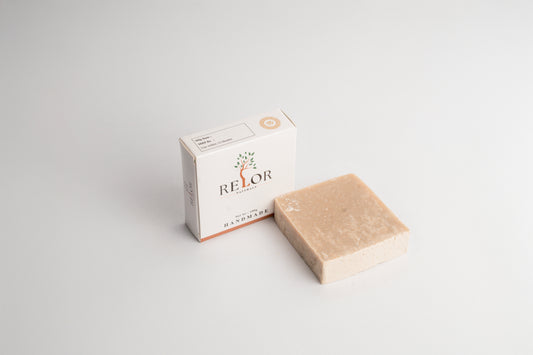 Handmade natural soap bar with RELOR NATURALS packaging for soft and healthy skin