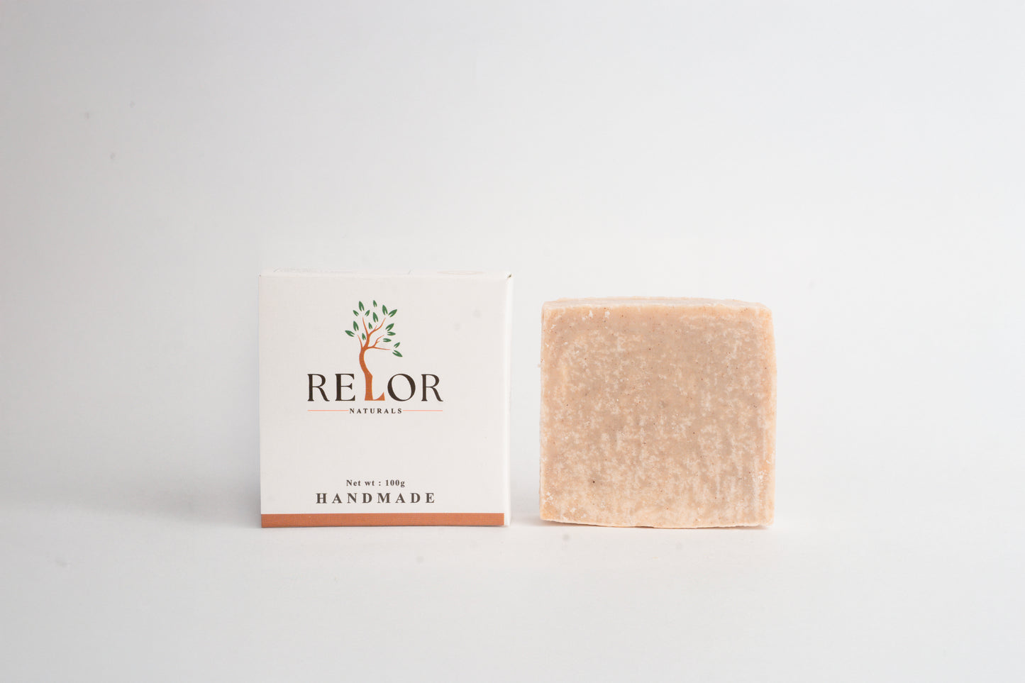 Handmade natural soap bar with RELOR NATURALS packaging for soft and healthy skin