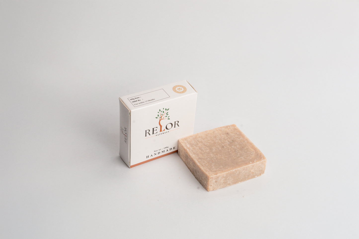 Handmade natural soap bar with RELOR NATURALS packaging for soft and healthy skin