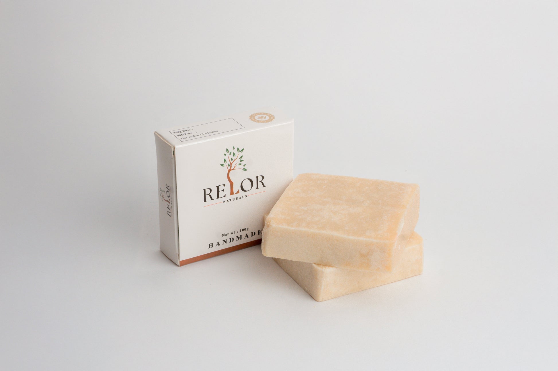 Handmade natural soap bar with RELOR NATURALS packaging for soft and healthy skin