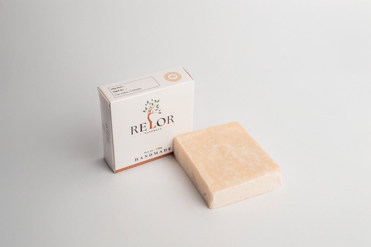Handmade natural soap bar with RELOR NATURALS packaging for soft and healthy skin