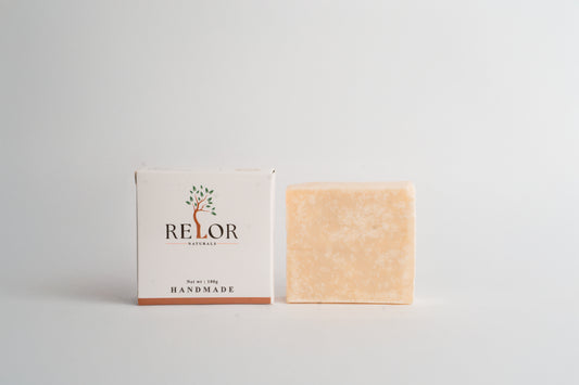 Handmade natural soap bar with RELOR NATURALS packaging for soft and healthy skin
